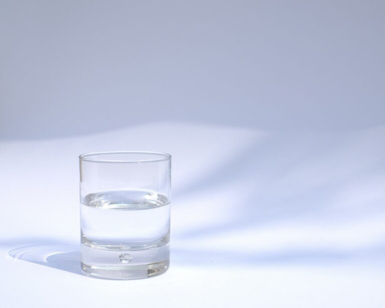 Clear drinking glass filled with water